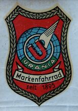 Urania-Logo, unbenutztes Abziehbild auf Trägerpapier.