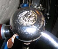 Klingel mit Motiv "Olympische Ringe"; Material: Stahl verchromt, verzinkt