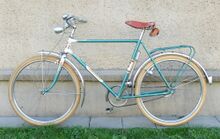 Der Kettenschutz fehlte im Fundzustand. Es könnte zu dieser Zeit auch noch ein Kettenschutz als Aluminium verwendet worden sein.