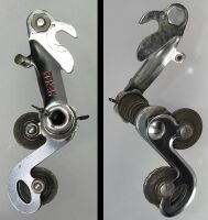 Zeitraum: 1961 - 1967 Verwendung: Diamant Rennräder Material: Stahl (verchromt) Bemerkungen: Schriftzug als rot ausgelegte Prägung mit großer Schrift; inneres Kettenleitblech mit Ausbruch an der unteren Rolle