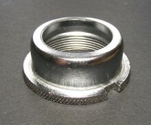 Abschlussmutter G Zeitraum: 1980er Jahre, bis 1990 Material: Stahl, verchromt