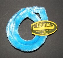 Nabenputzringe "Wüma" Zeitraum: hier: nach 1967 Hersteller: Wünsche & Co, Marienberg/VEB Zellstoffverarbeitung Material: Chenilledraht Bemerkungen: Einfarbig, mehrere Farben bekannt. Etikett geprägt. Produziert bis vrmtl. Ende der 1980er Jahre.